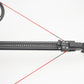 Compound bow with red strings on a white background, featuring Wild Slingbow logo.
