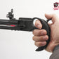 Hand holding a black crossbow against a white background