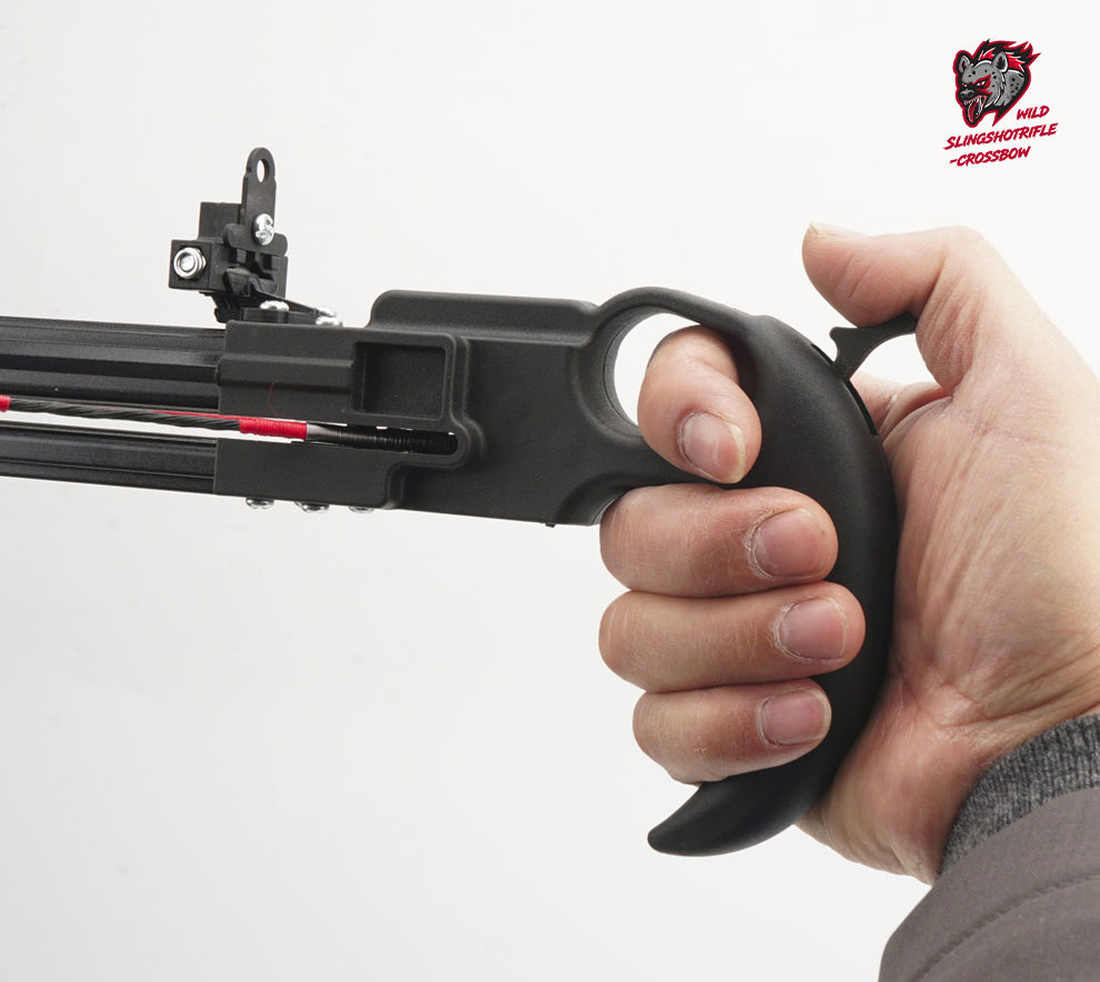 Hand holding a black crossbow against a white background